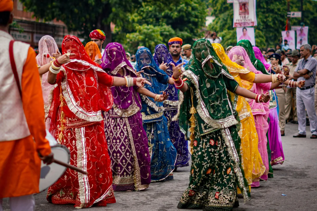 Women dancing together in a Rajasthani street procession
