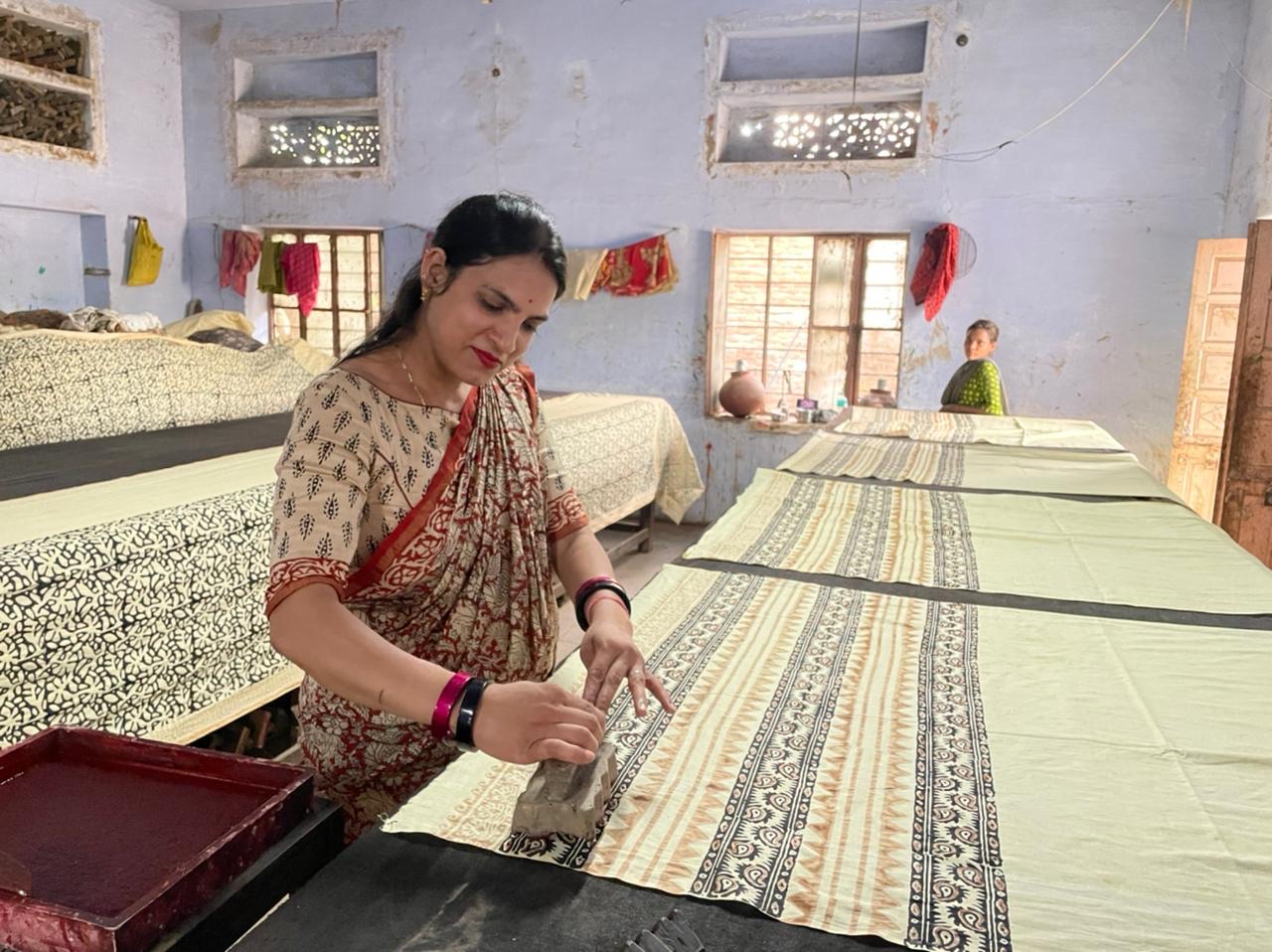 A woman making a hand block print in Bagru village near Jaipur